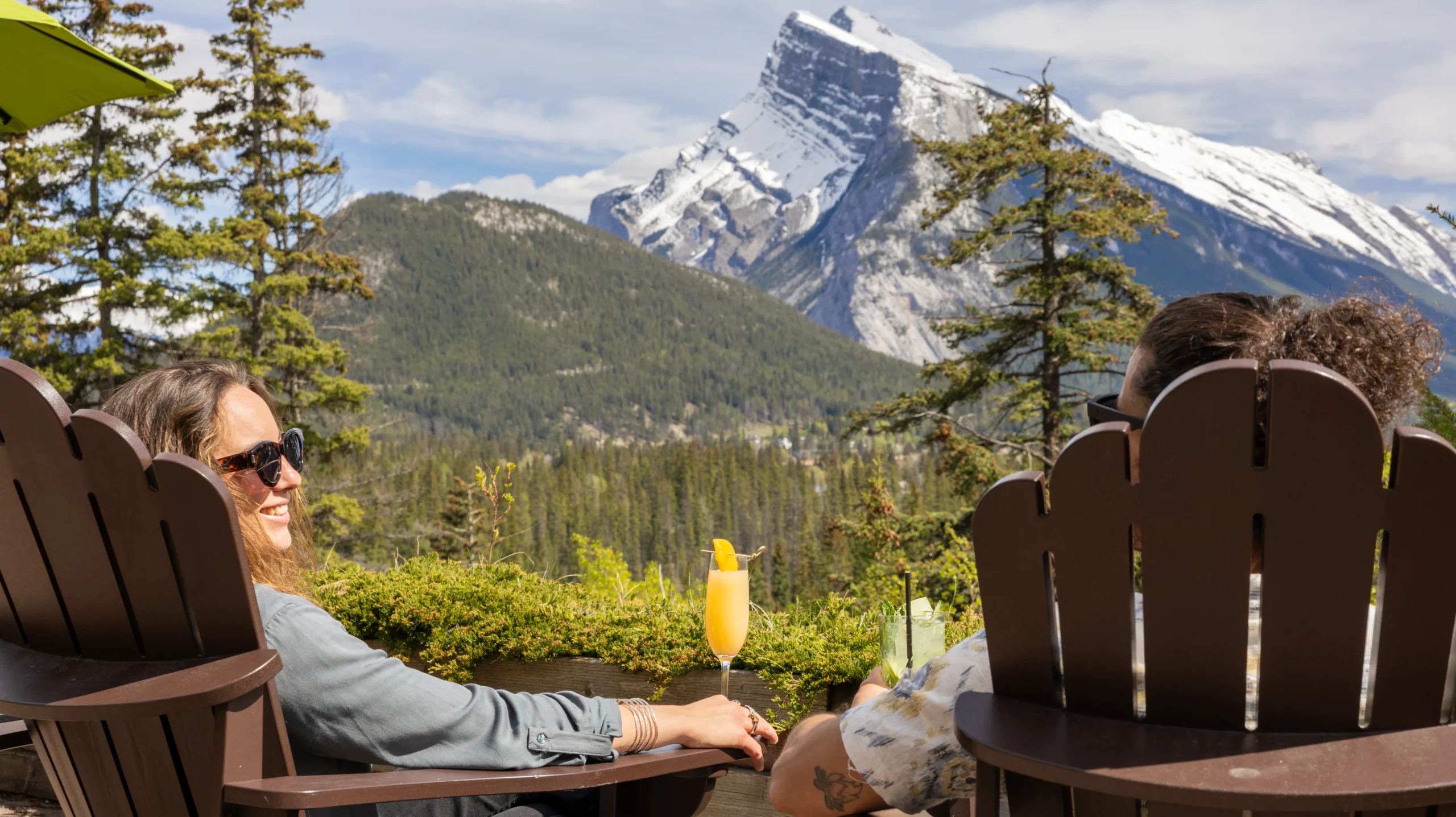 A couple look over the panoramic views from the Juniper Bistro