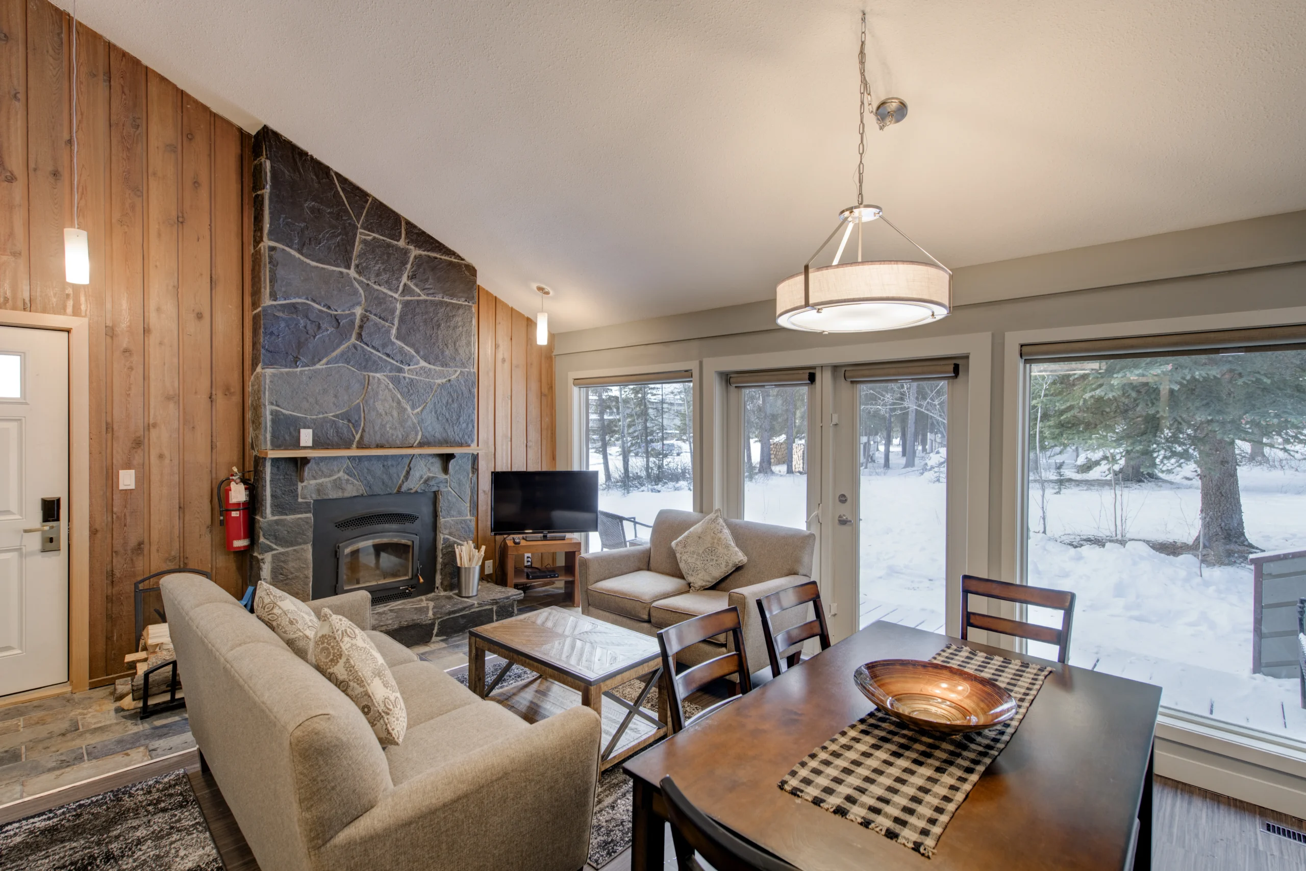 The Forest Cabins interior with kitchen and fireplace