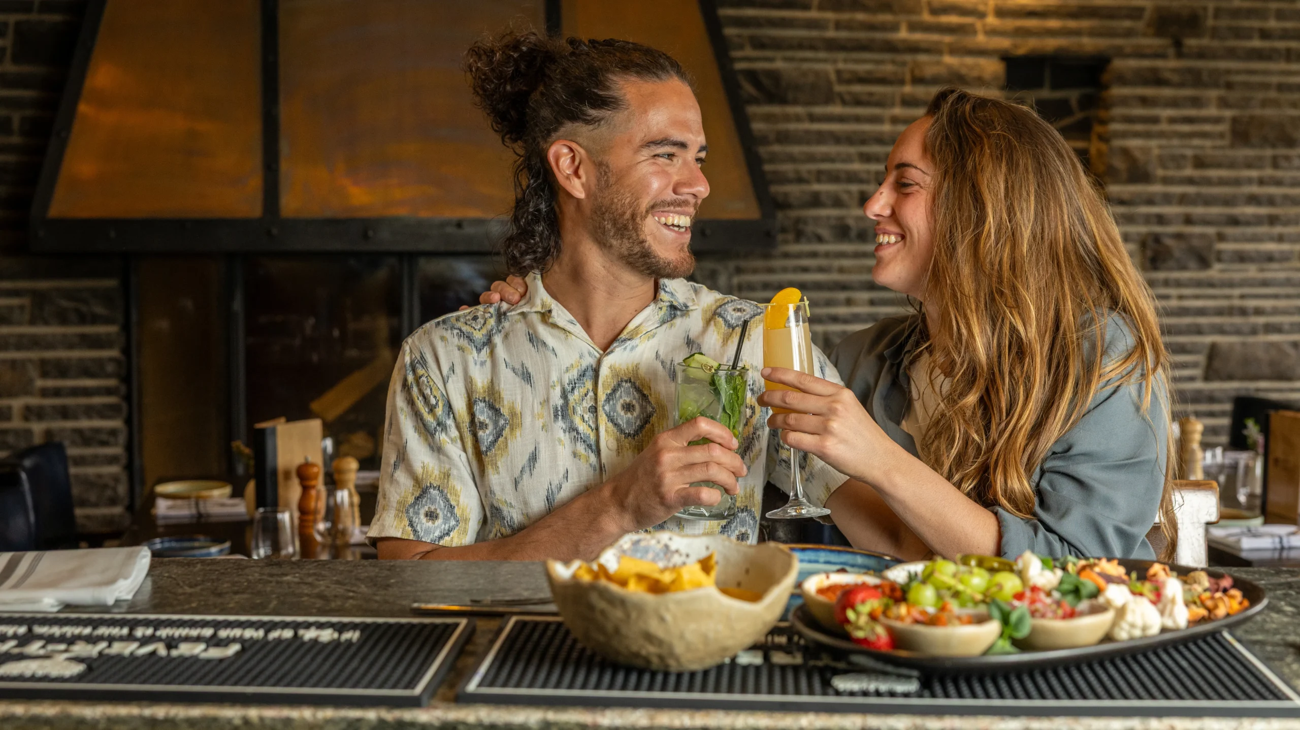A couple enjoy the Juniper Bistro Lounge bar