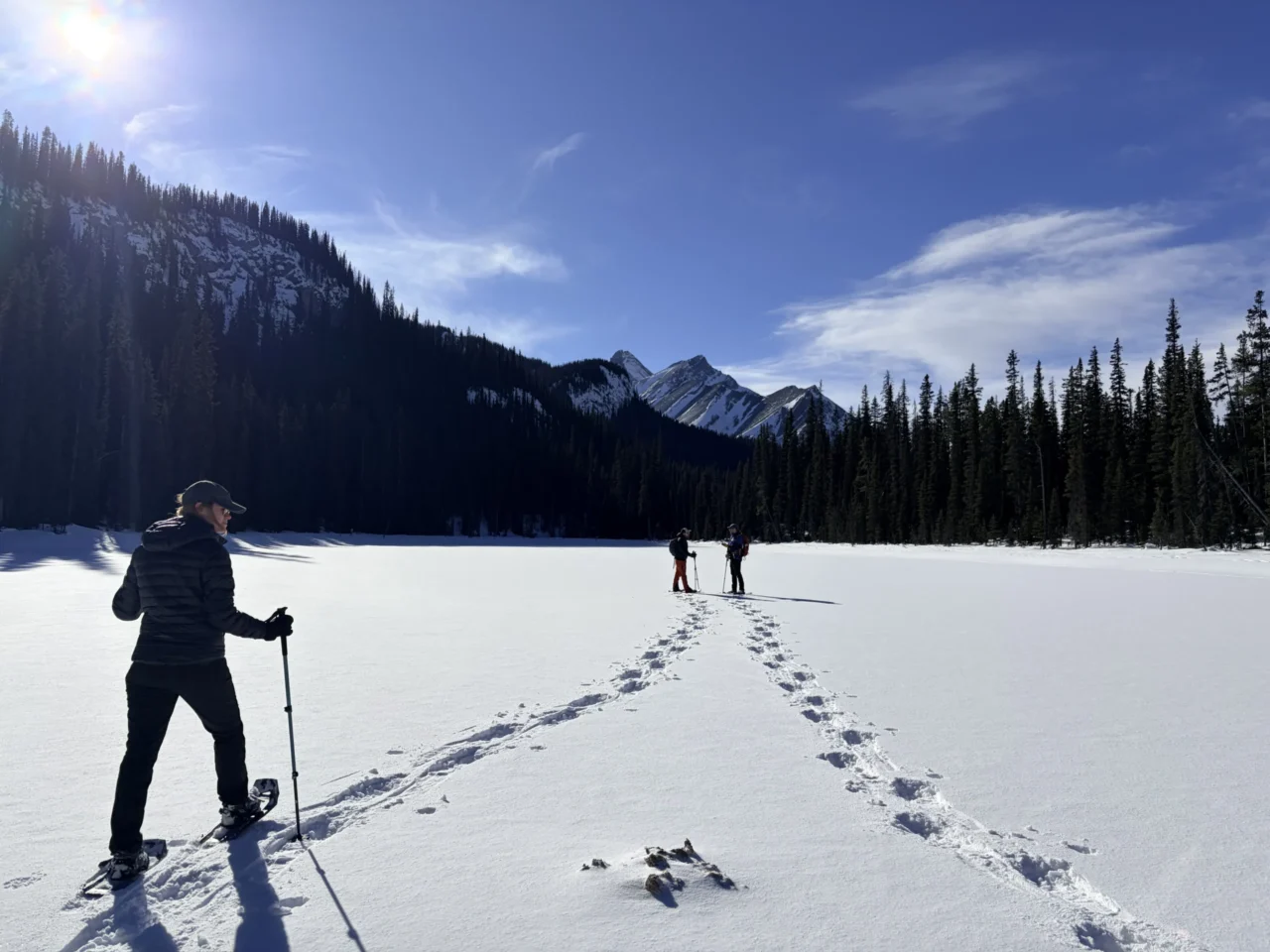 A group of friends take the Juniper snowhoe rentals on a hike