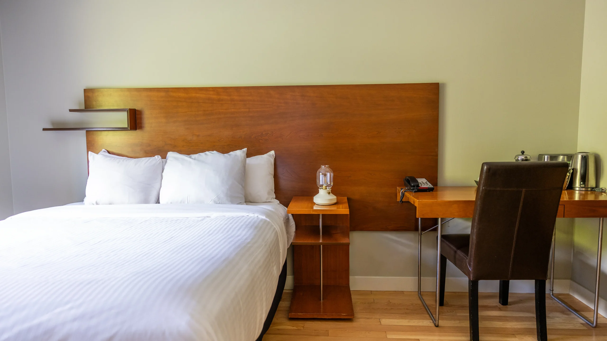 The Queen Accessible room at the Juniper features a step-free shower and wide spaces between the bed and furniture in a comfortable room.