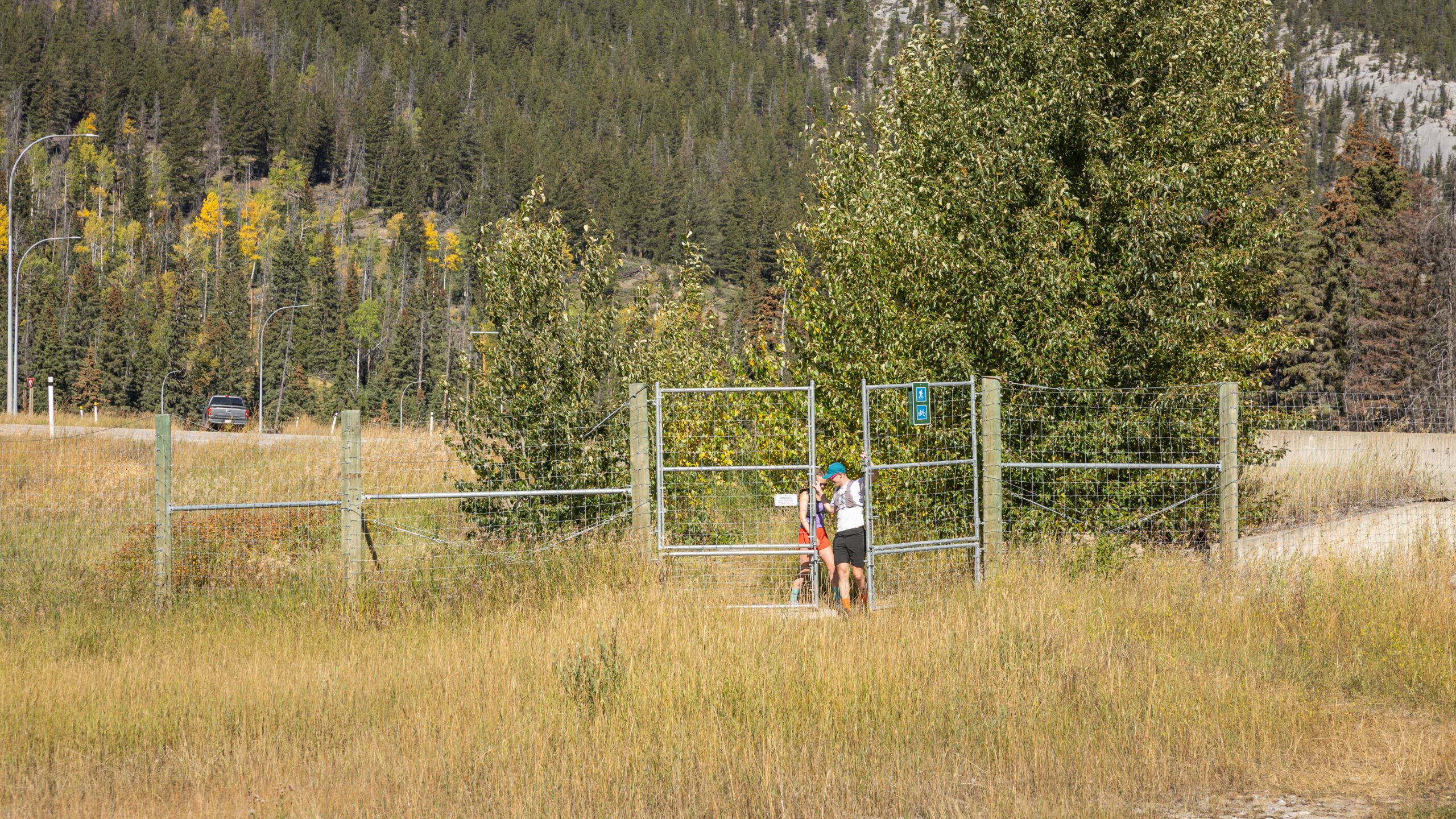 A couple opening the first gate.