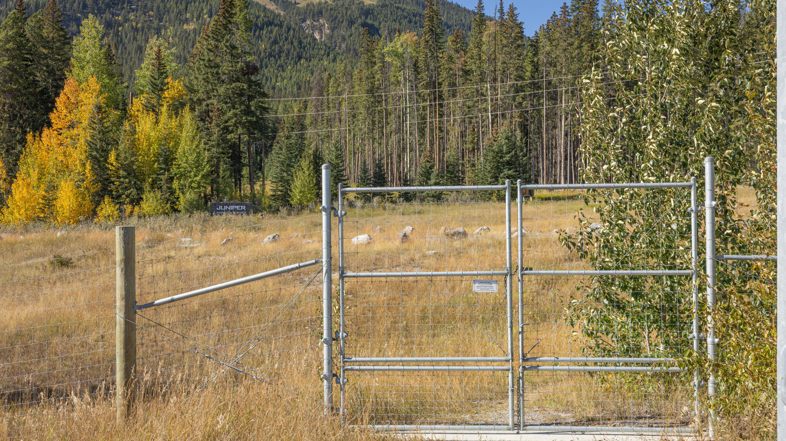 Image showing the 2nd gate from Banff to the Juniper with the Juniper sign in the background